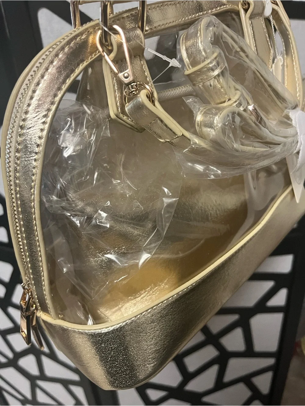 Gold clear two and one purse with handles and gold straps.